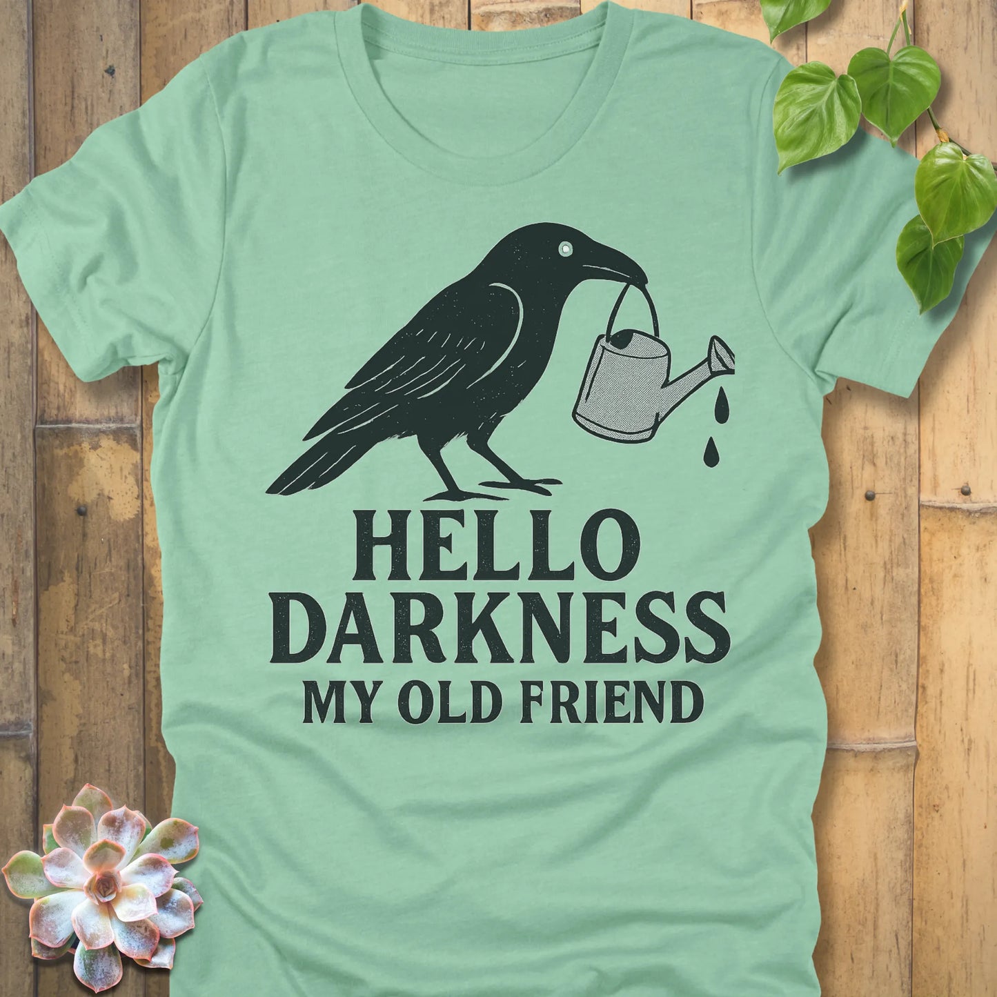 Heather Mint – Hello Darkness T-shirt in Heather Mint, crow watering can graphic, lightweight Bella+Canvas unisex tee.