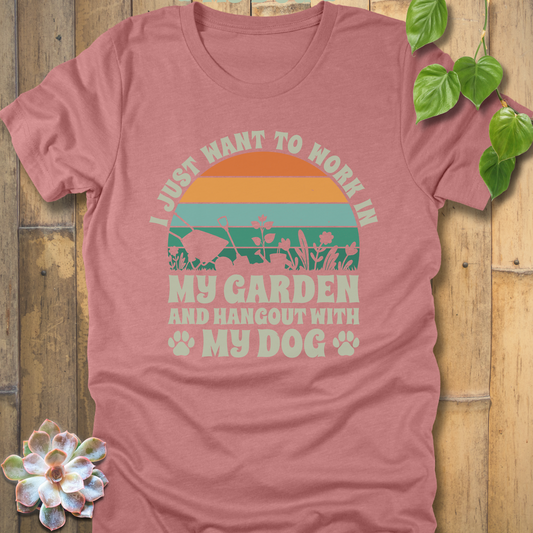 Heather Mauve t-shirt with a retro stripe sunset design, garden tools, and slogan text I just want to work in my garden and hang out with my dog, with paw prints at the bottom