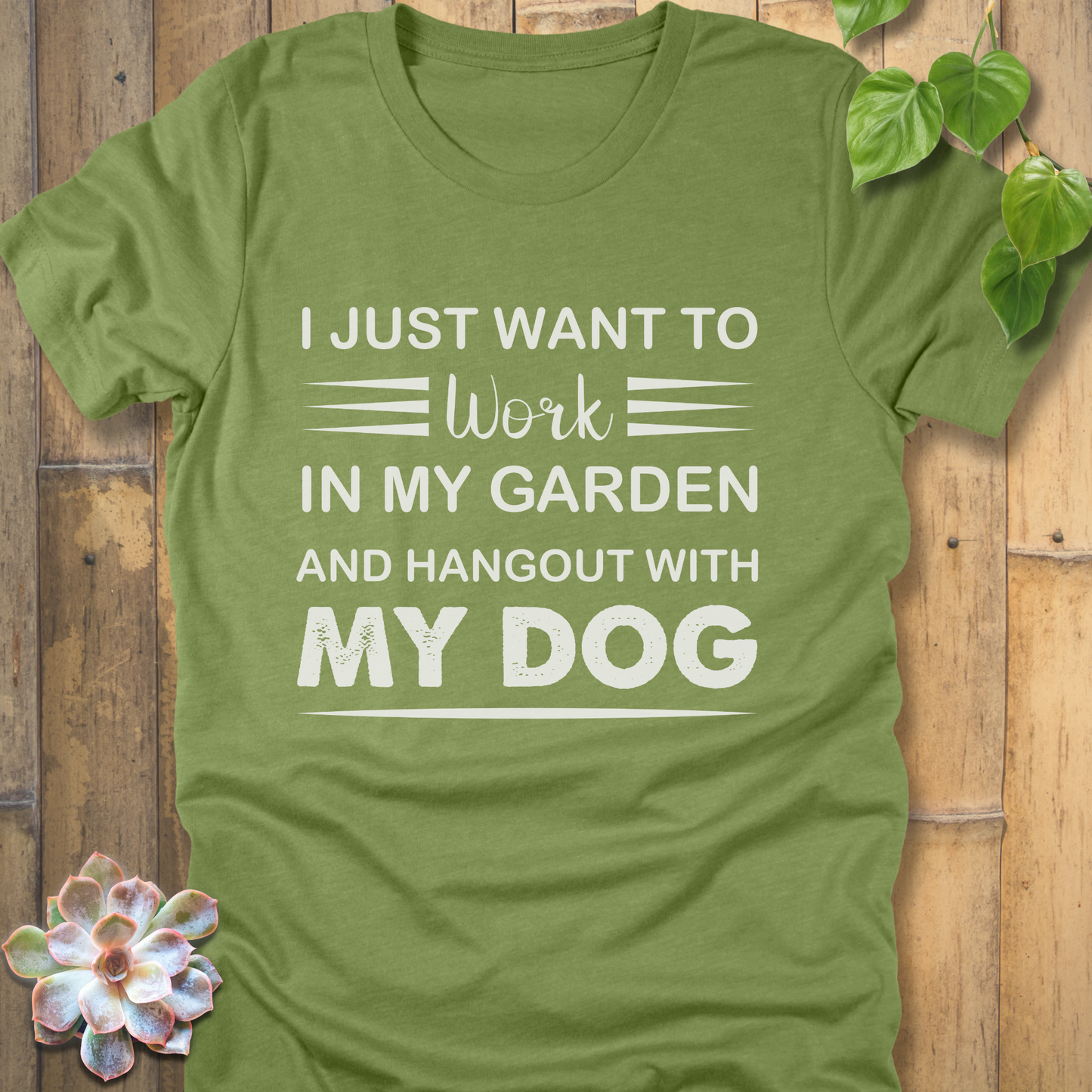 Heather Green t-shirt featuring the design "I just want to work in my garden and hangout with my dog" printed in white letters