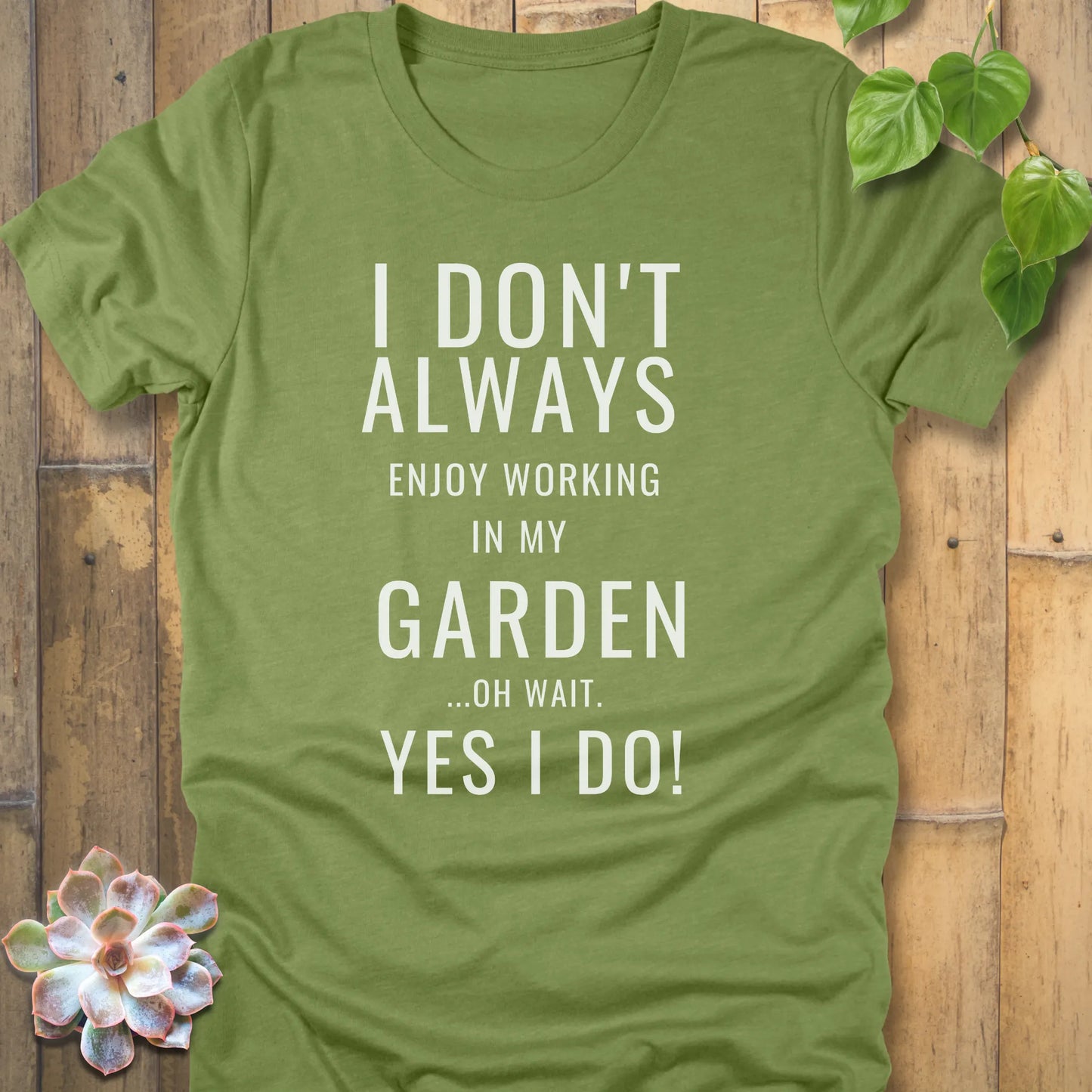 Heather Green t-shirt featuring the design "I don't always enjoy working in my garden, oh wait yes I do" printed in bold white letters