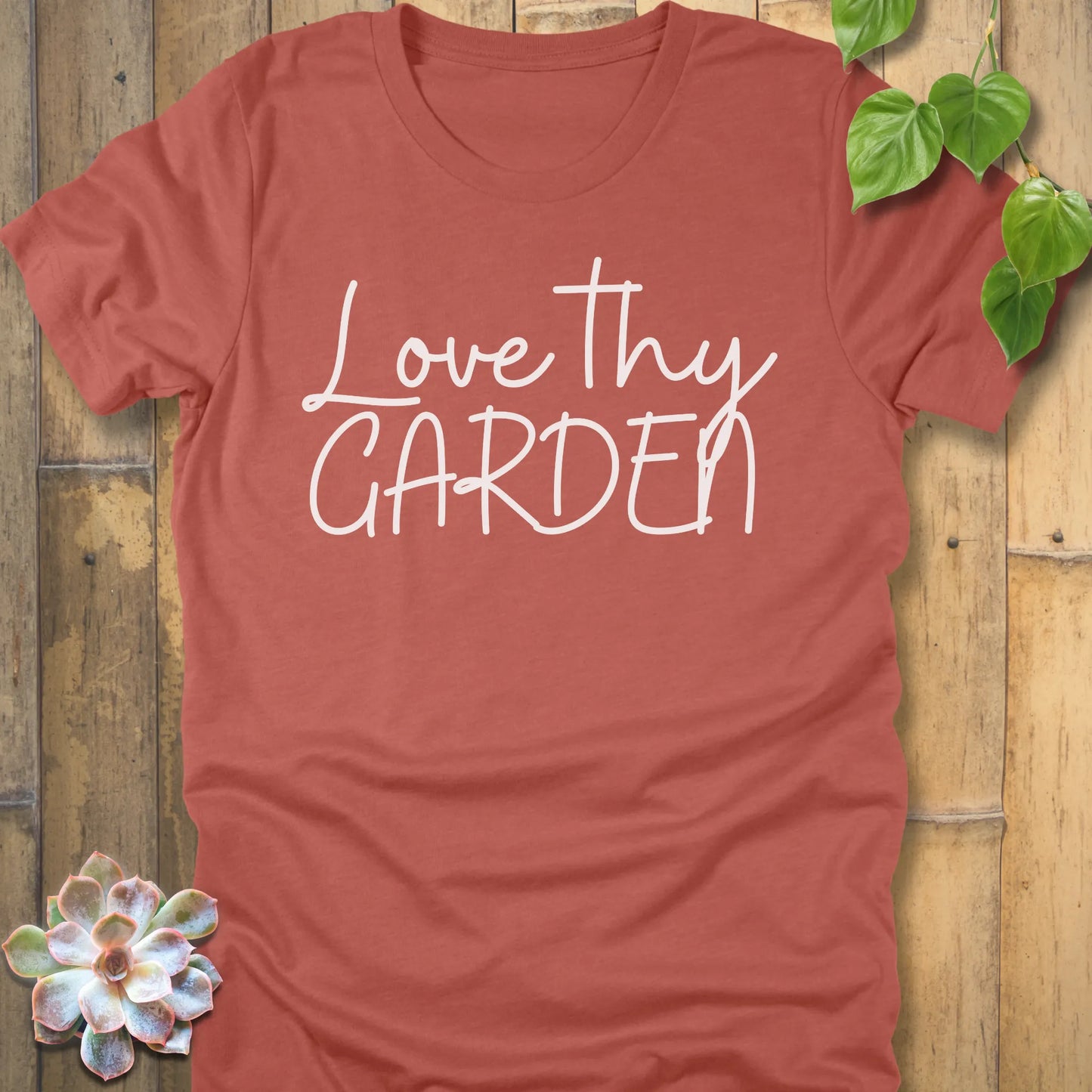 Heather Clay t-shirt featuring the design Love Thy Garden printed in white letters
