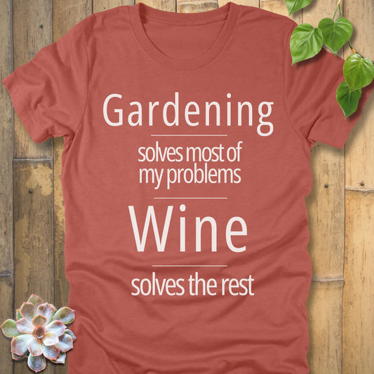 Heather Clay unisex gardening t-shirt with white text design that says ‘Gardening solves most of my problems, wine solves the rest’