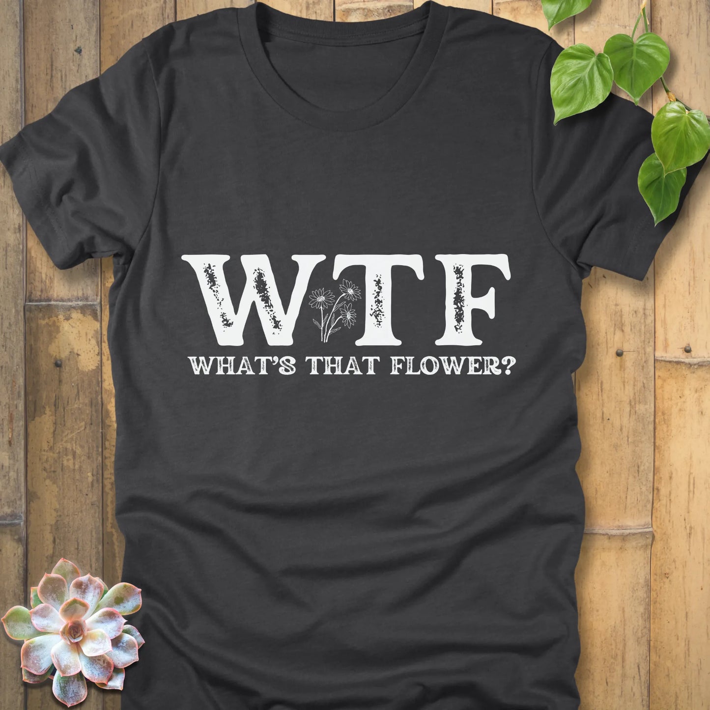Dark Grey Heather novelty t-shirt with large WTF letters, What’s That Flower printed beneath, and a flower graphic in the center