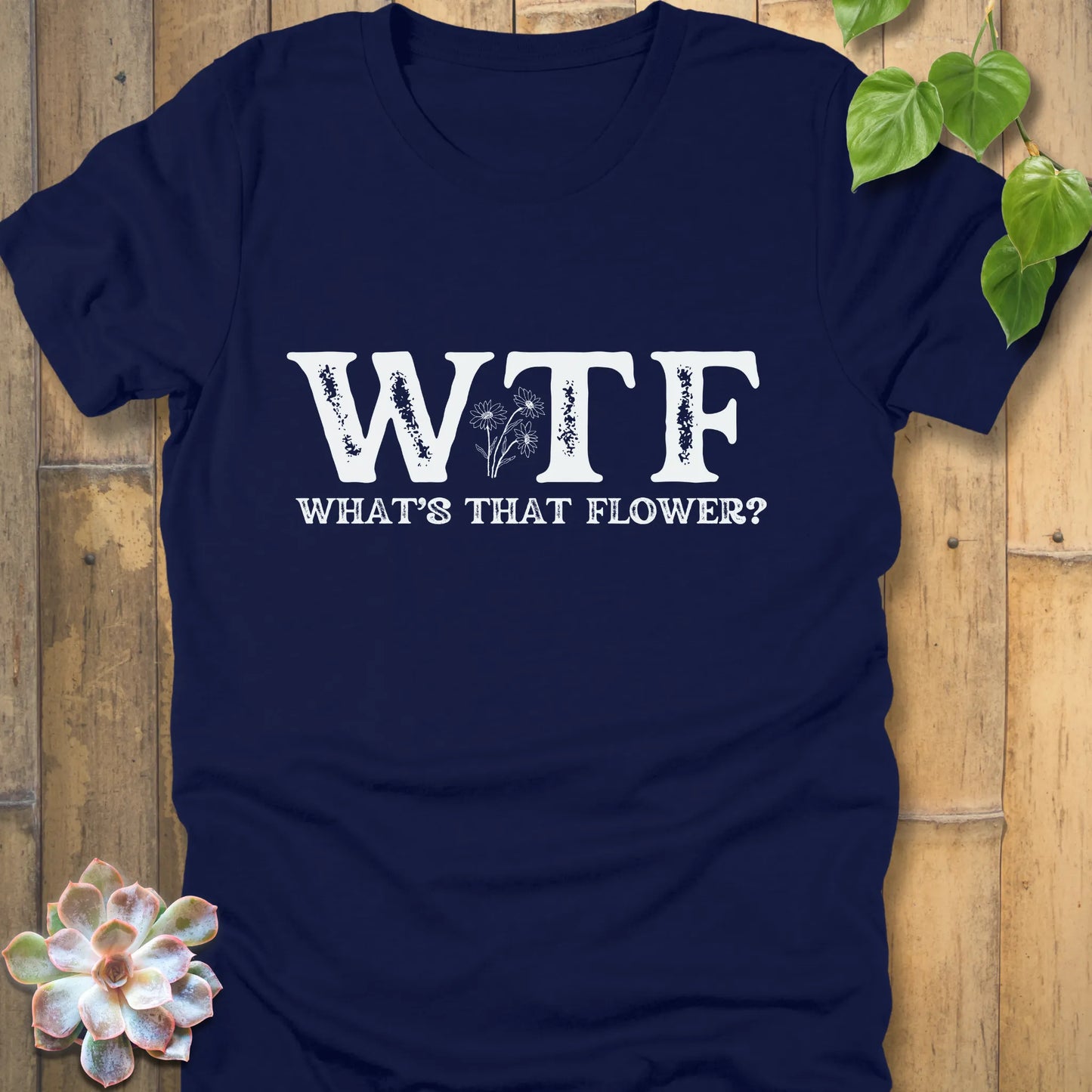 Heather Navy garden-inspired t-shirt with white WTF letters, What’s That Flower slogan, and floral illustration