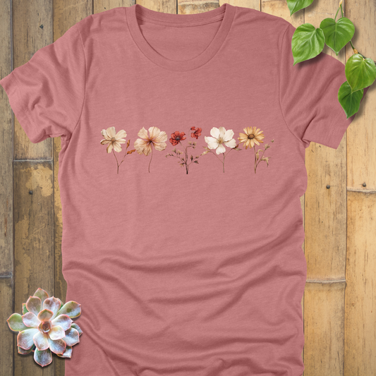 Heather Mauve t-shirt with vintage-style dried wildflower artwork across the chest in cream, orange, and red shades