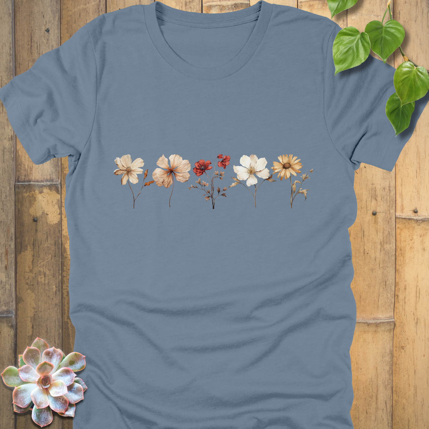 Steel Blue t-shirt with detailed dried wildflower design showing blossoms in cream, burnt orange, and red across the chest.