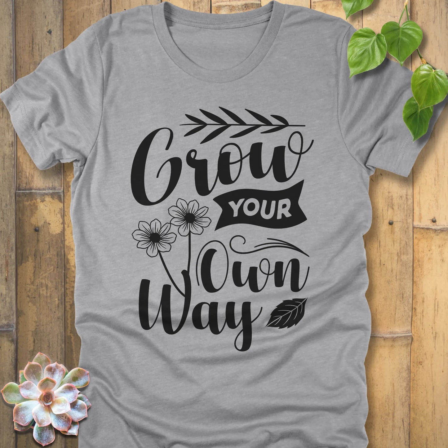 Athletic Heather cotton graphic t-shirt featuring the inspirational phrase Grow your own way, stylish casual wear.
