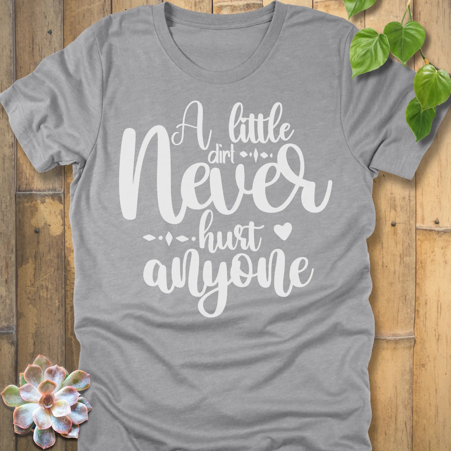 Athletic Heather gardening t-shirt featuring the design A Little Dirt printed in white letters