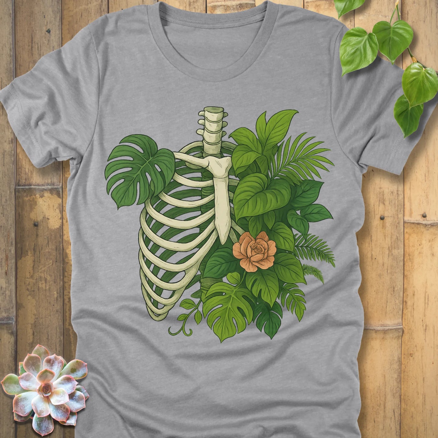 Athletic Heather t-shirt featuring the design Jungle Bones printed in bones, leaves and flowers, casual jungle graphic shirt.