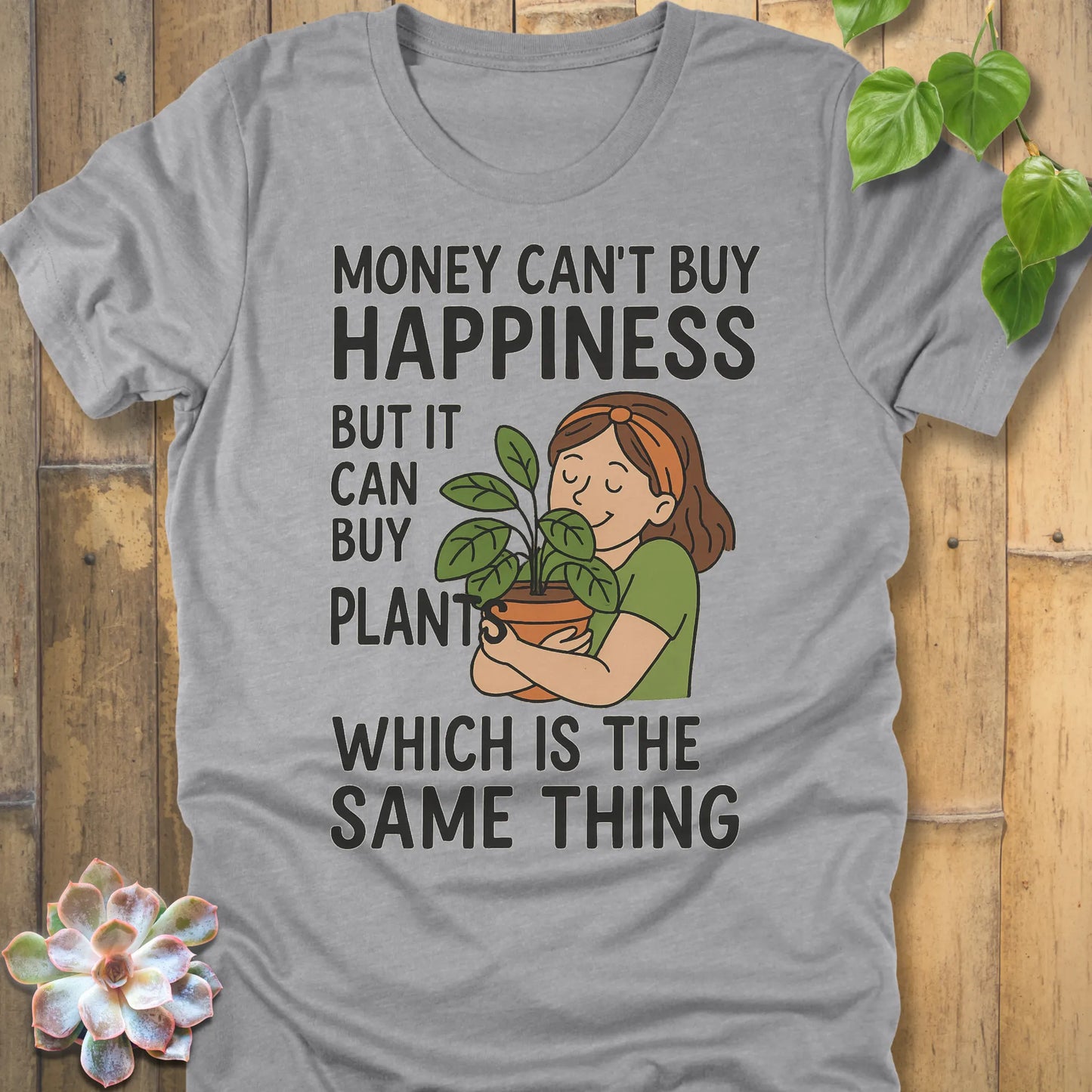 Athletic Heather t-shirt featuring the design Money Can Buy Happiness printed in bold black letters, casual streetwear shirt.