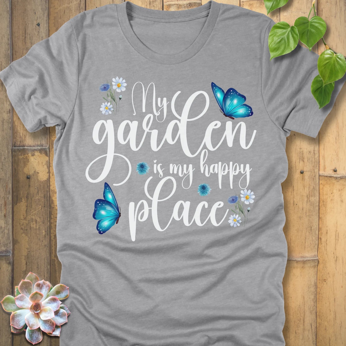 Athletic Heather t-shirt featuring the design My Garden Is My Happy Place with blue butterfly and flowers, funny floral gardening shirt for women.