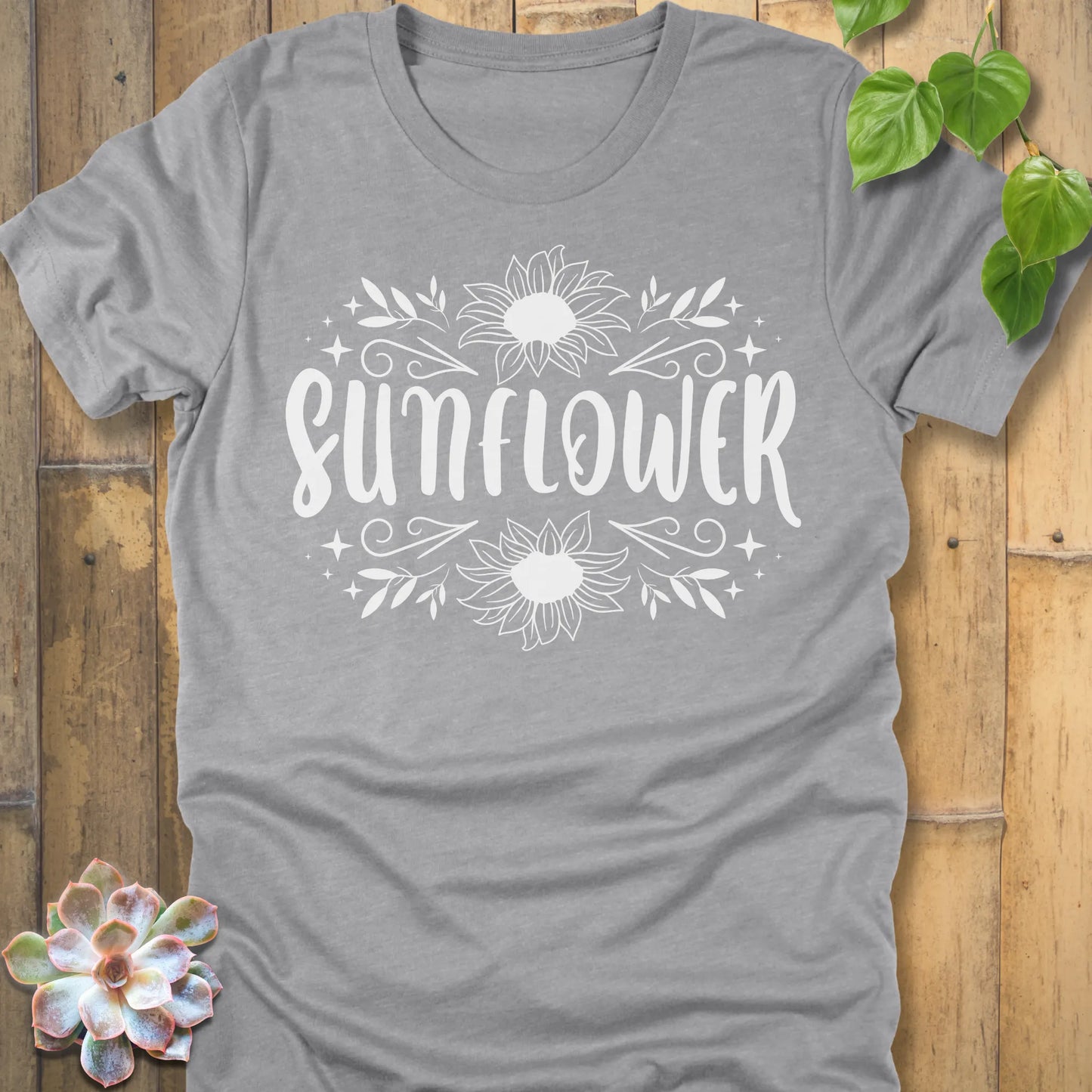 Athletic Heather t-shirt featuring the design Sunflower printed in white letters and sunflower, floral graphic tee.