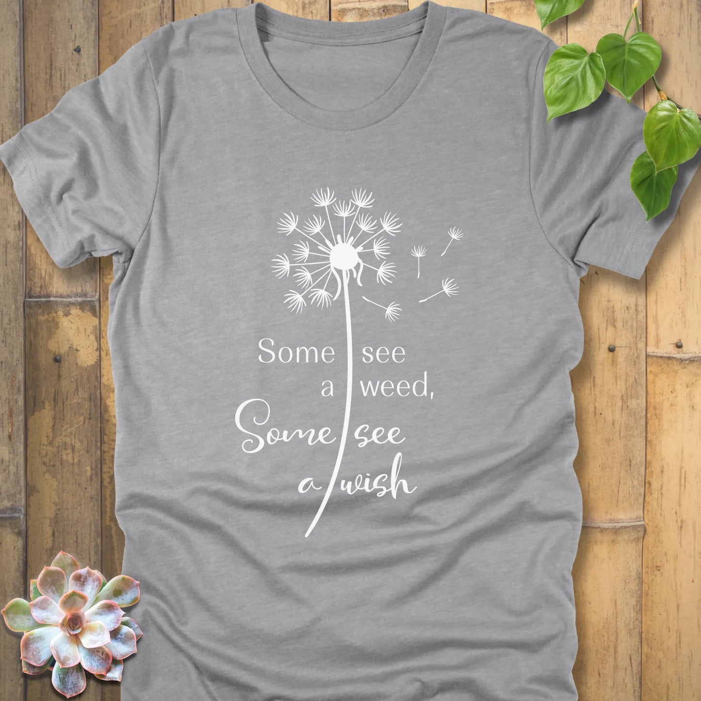 Athletic grey t-shirt featuring the dandelion design with the quote "Some see a weed, Some see a wish"