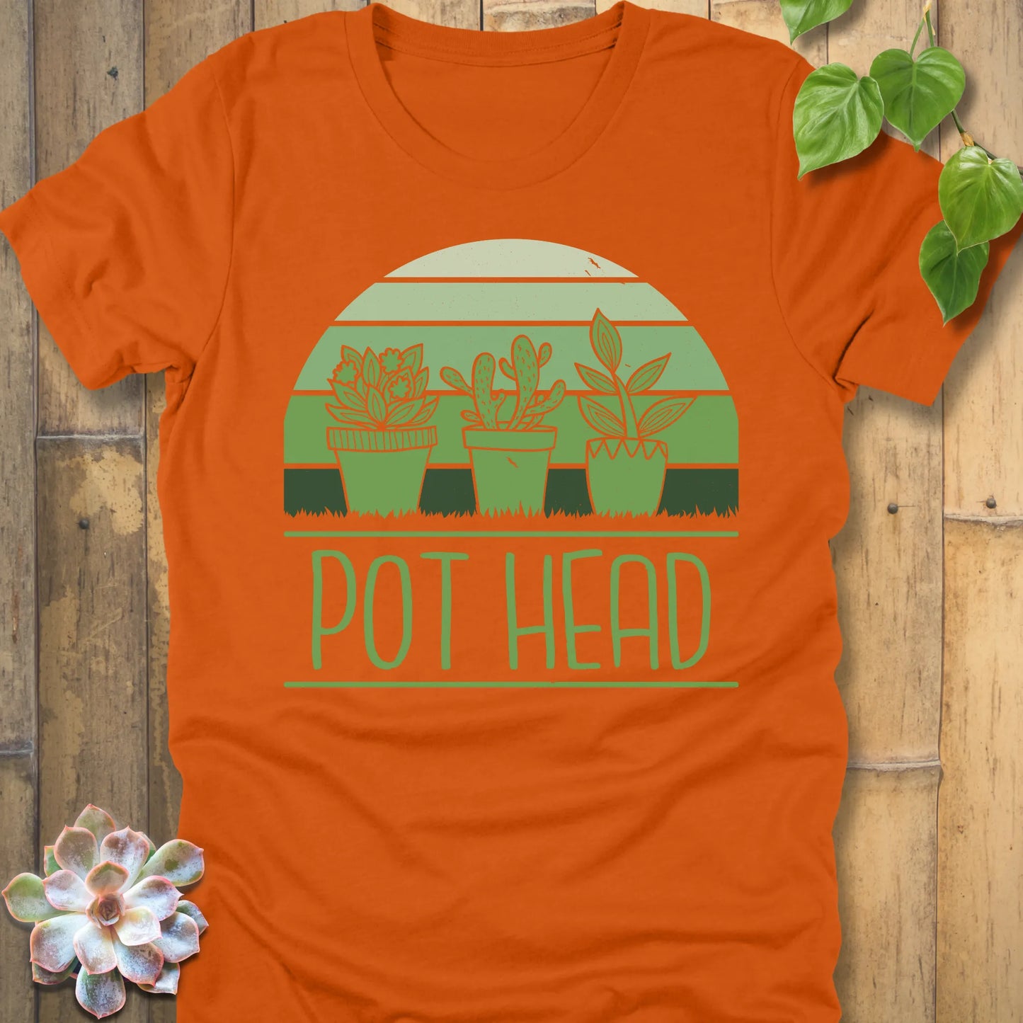 Autumn t-shirt featuring the design Pot Head printed in bold letters and 3 different plant in the pots, funny plant lover shirt.