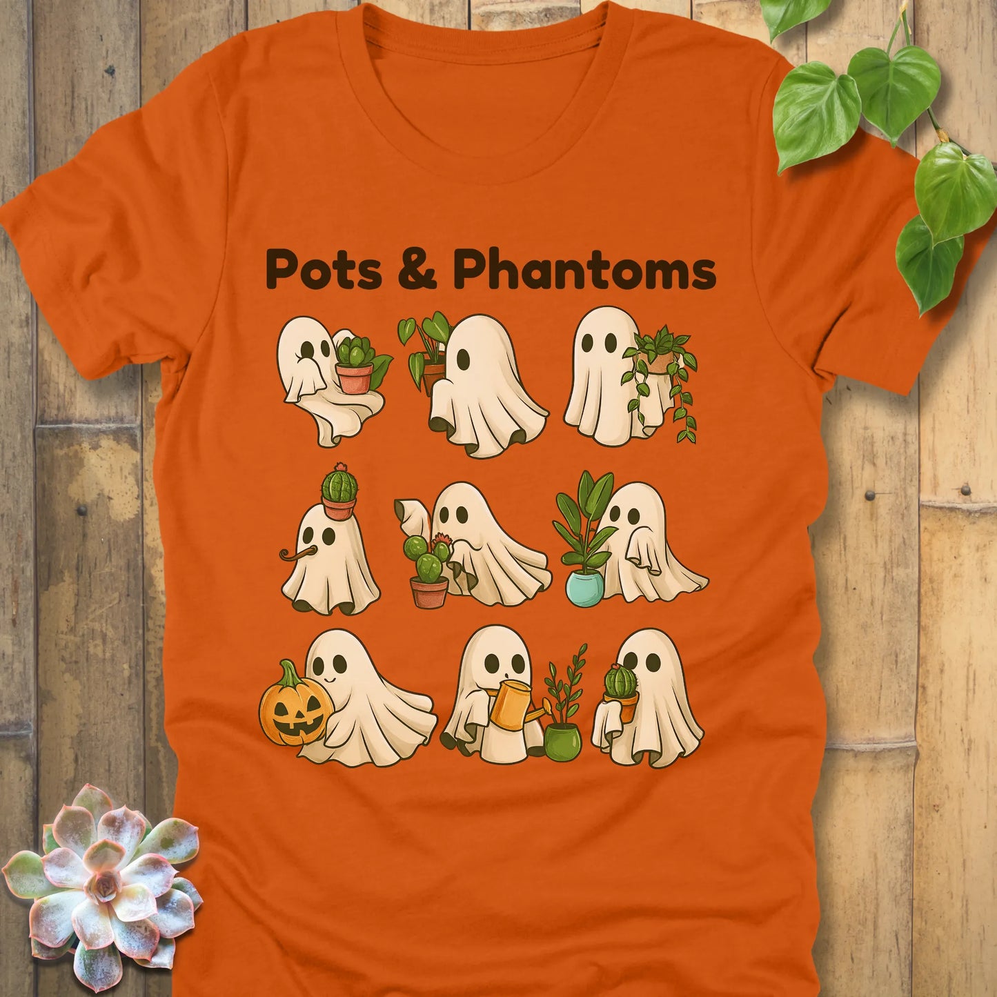 Autumn t-shirt featuring the design Pots & Phantoms printed in  black letters and a ghost holding a plants, pumpkin and water sprinkler