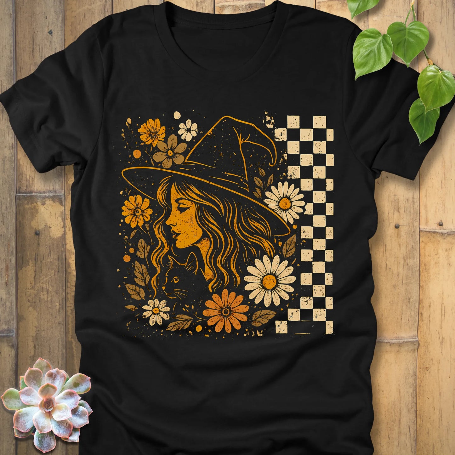 Black t-shirt featuring the design Garden Witch Vibes printed with a witch and flowers