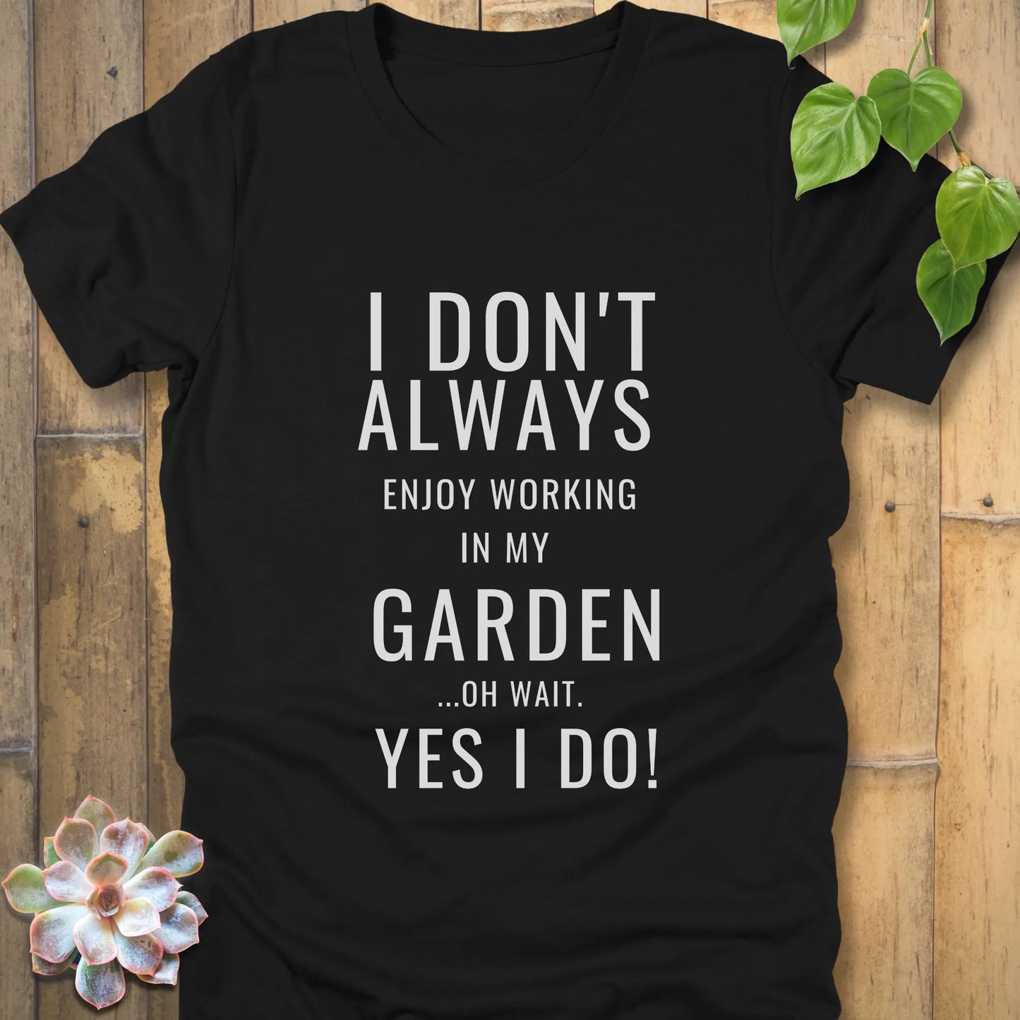 Black t-shirt featuring the design "I don't always enjoy working in my garden, oh wait yes I do" printed in bold white letters
