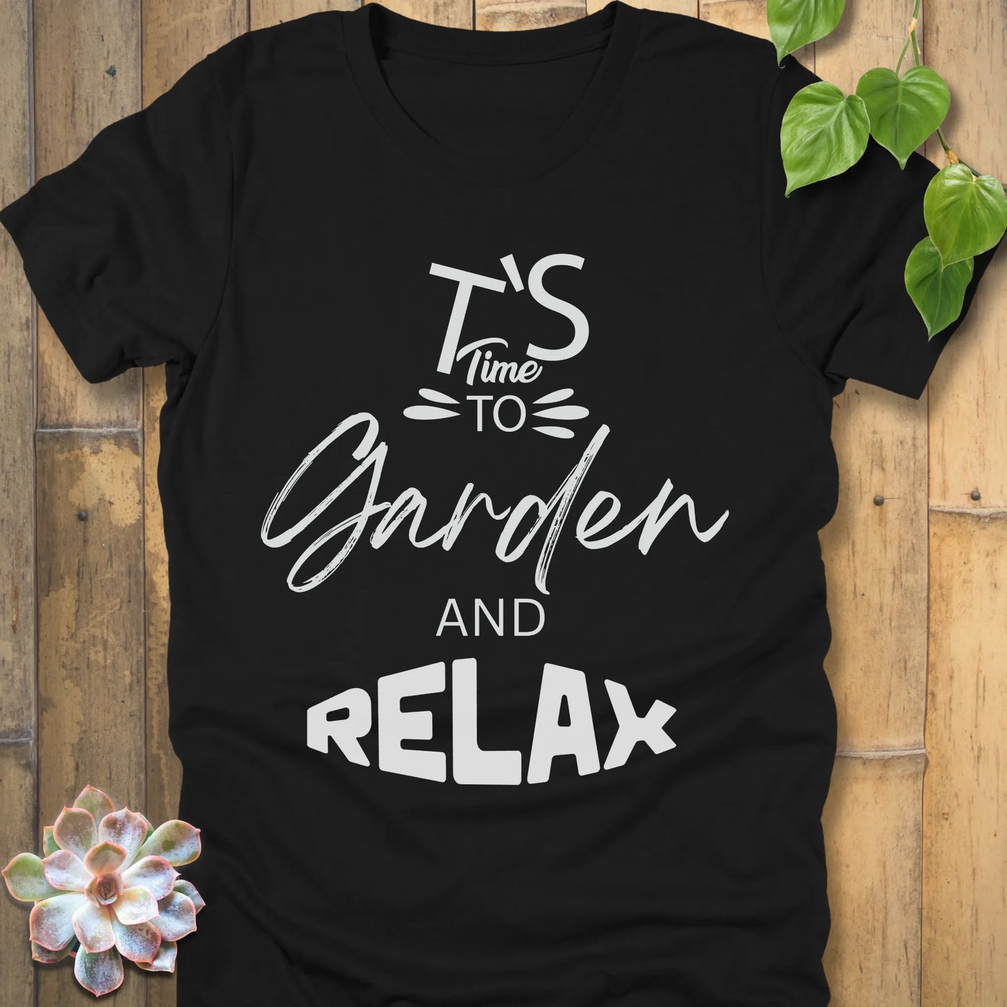Black t-shirt featuring the design "It's Time to Garden and Relax" printed in white letters