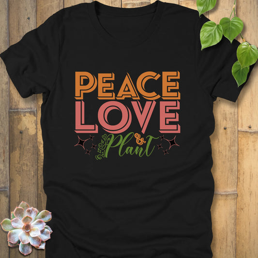 Black t-shirt featuring the design Peace Love Plant printed in bold letters, minimalist eco fashion tee
