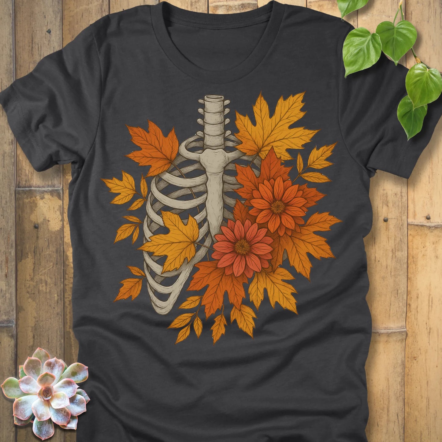 Dark Grey Heather t-shirt featuring the design Autumn Bones printed Halloween skeleton shirt with flowers and leaves.