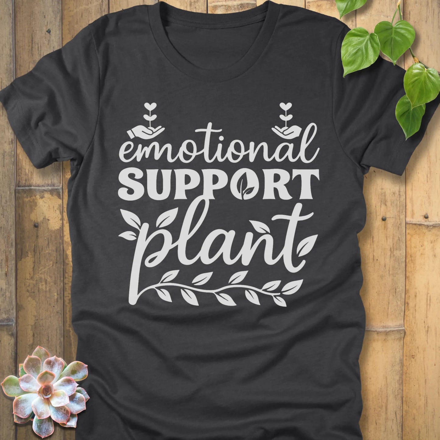 Dark Grey Heather t-shirt featuring the design Emotional Support printed in bold white letters, casual mental health shirt.