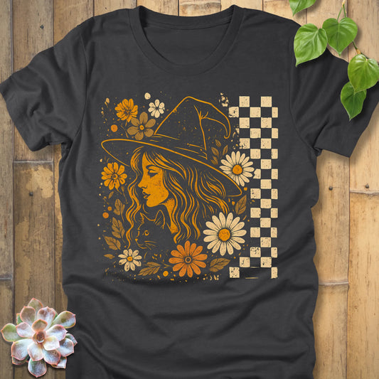 Dark Grey Heather t-shirt featuring the design Garden Witch Vibes printed with a witch and flowers