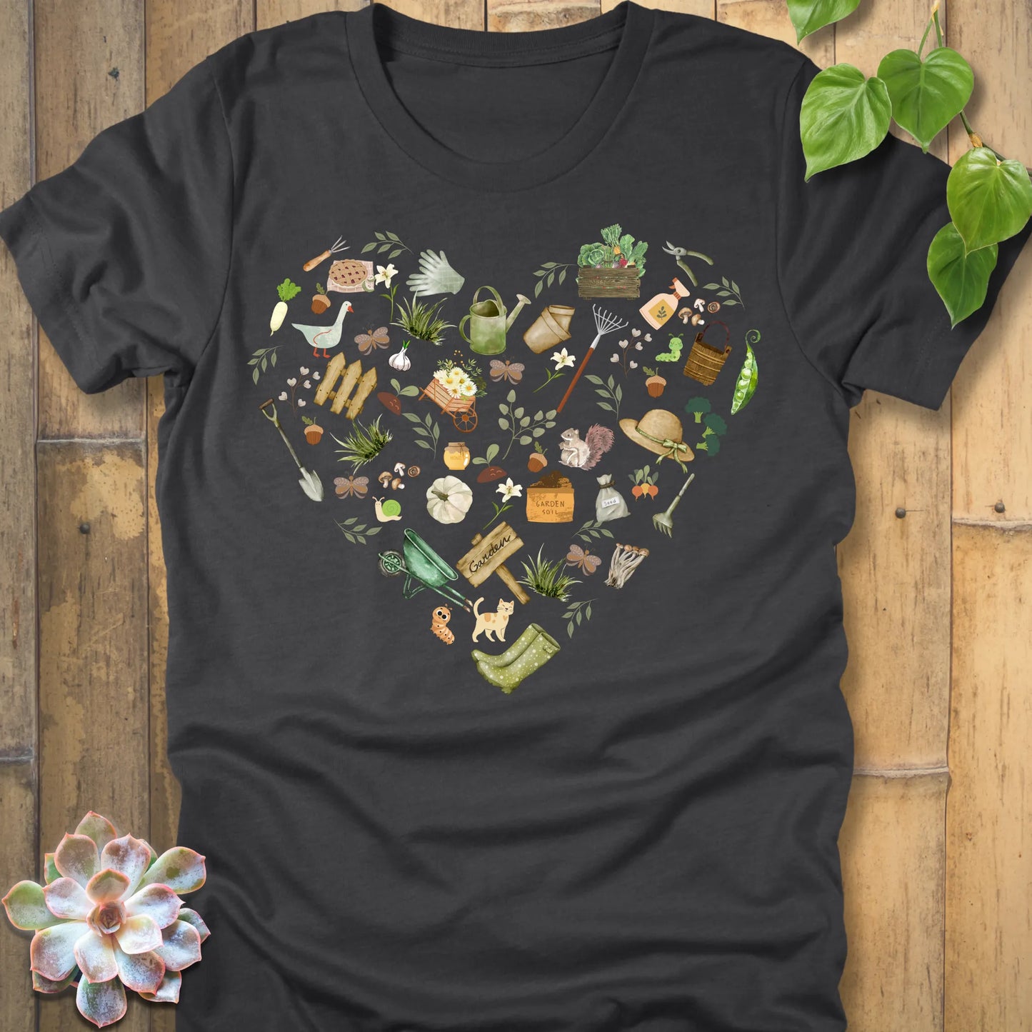 Dark Grey Heather t-shirt featuring the design Gardening Loveheart printed in heart shape with tools, plant lover shirt.