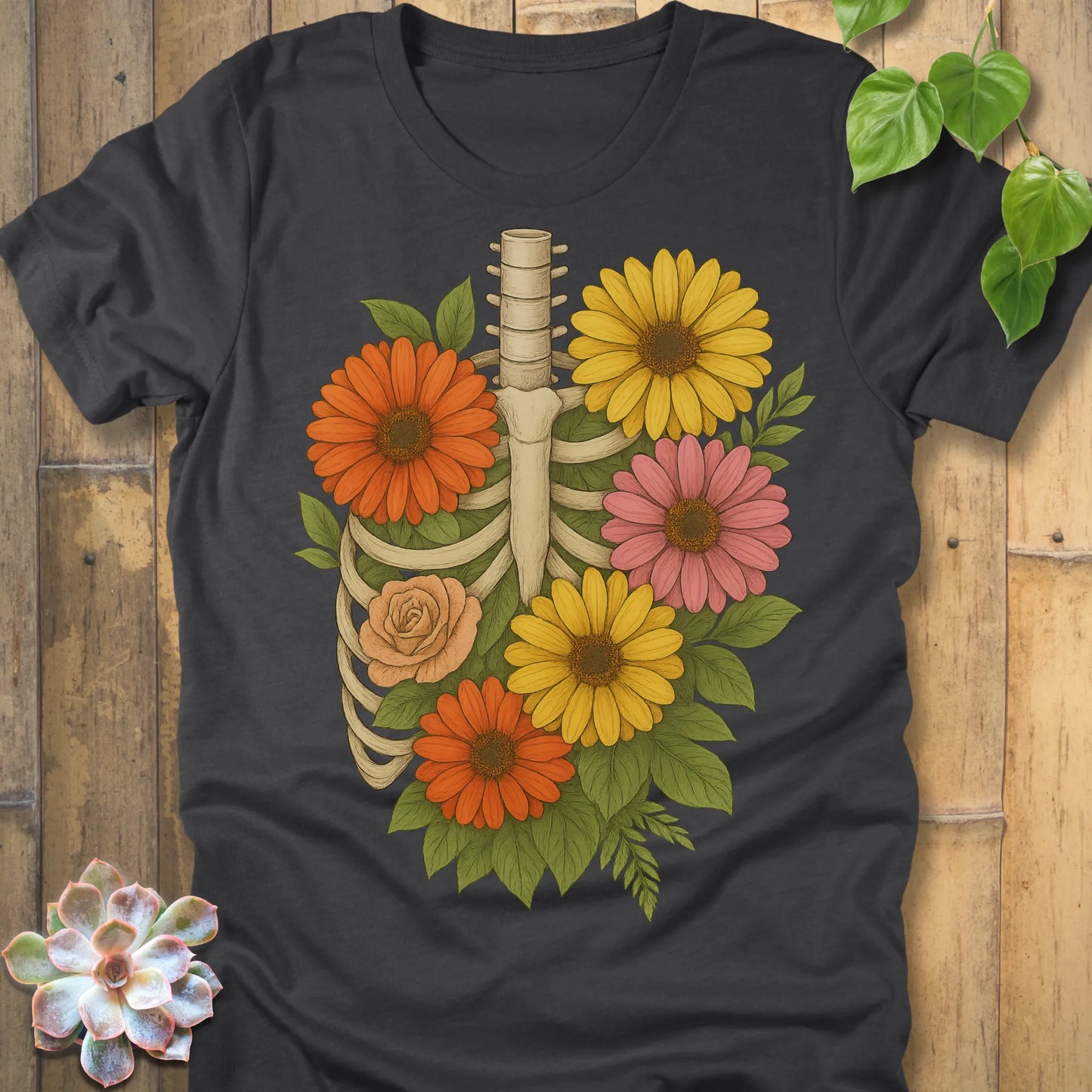 Dark Grey Heather t-shirt featuring the design Gerbera Bones halloween floral skeleton graphic tee.