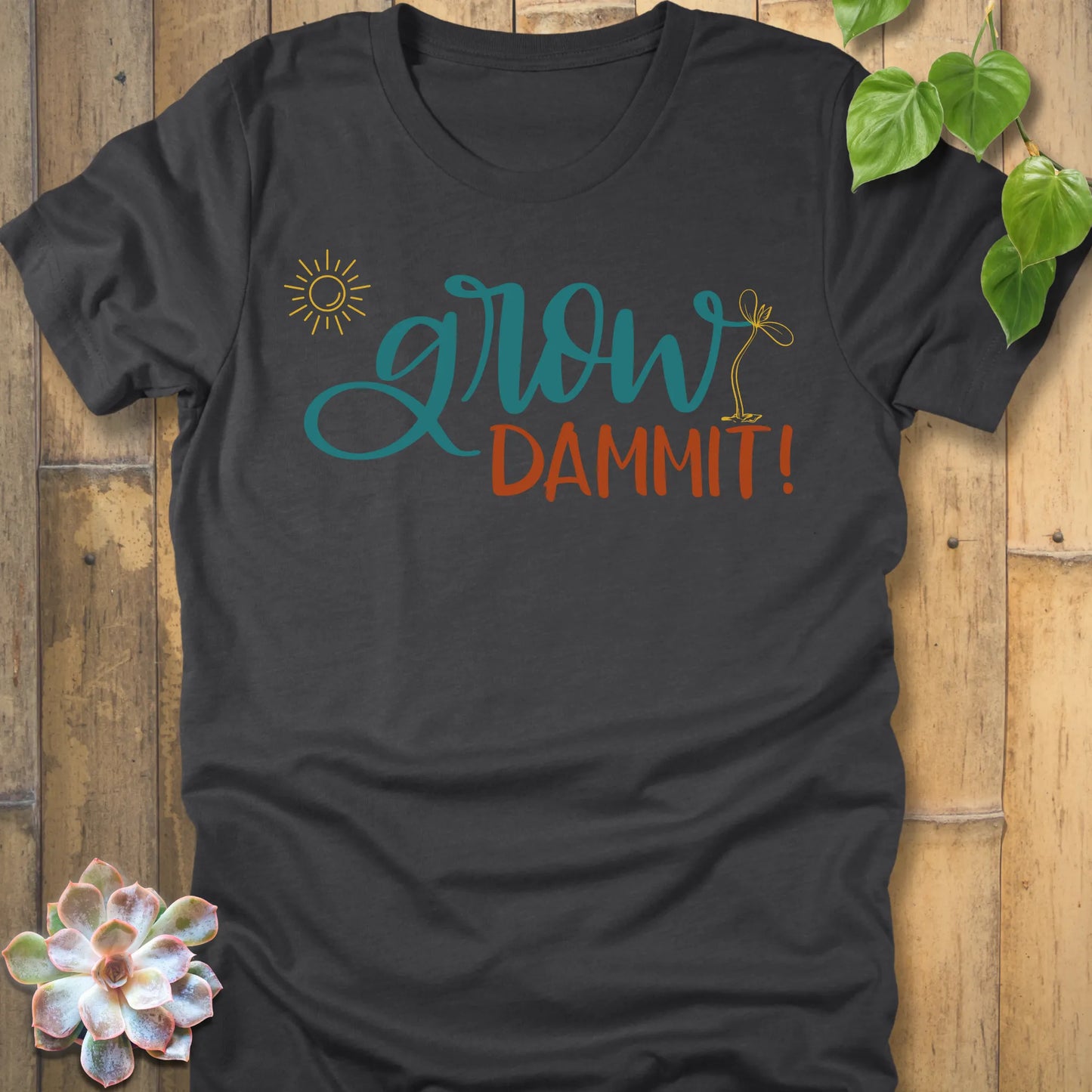 Dark Grey Heather t-shirt featuring the design Grow Dammit printed in bold letters, casual gardening shirt.
