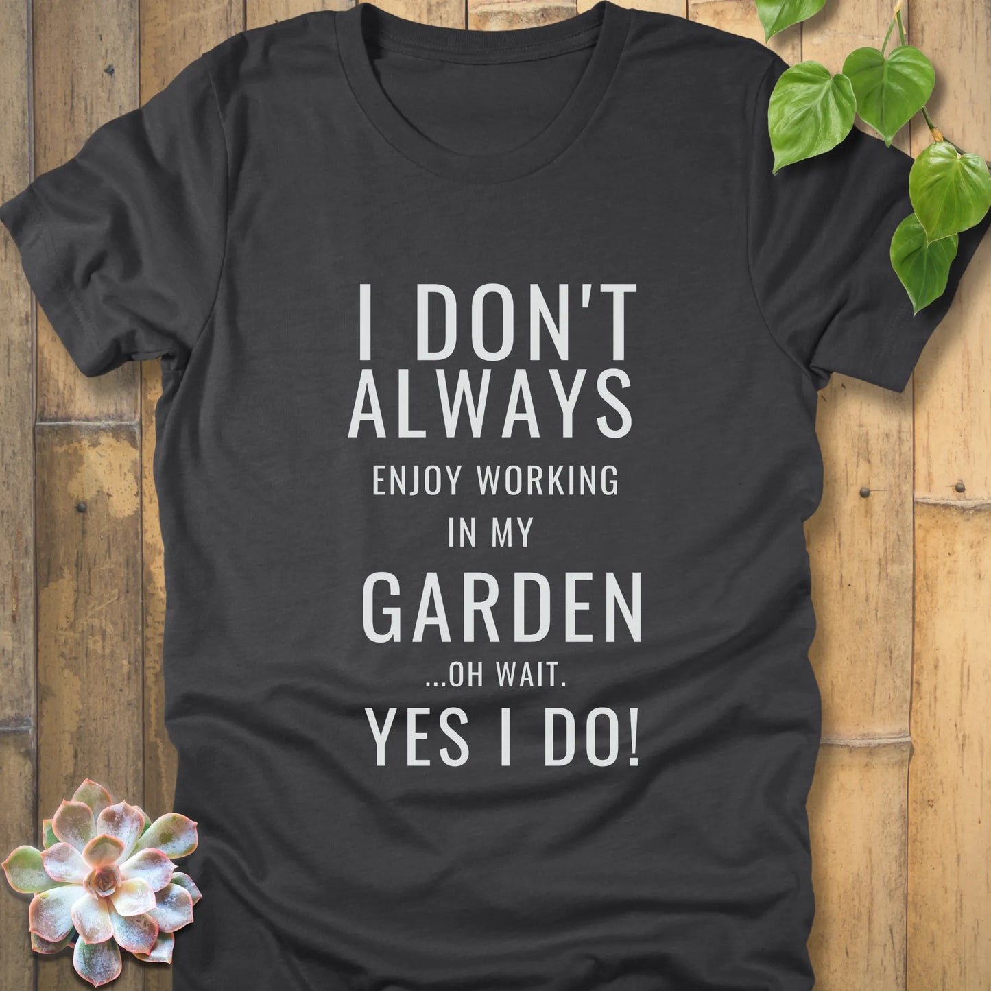 Dark Grey Heather t-shirt featuring the design "I don't always enjoy working in my garden, oh wait yes I do" printed in bold white letters