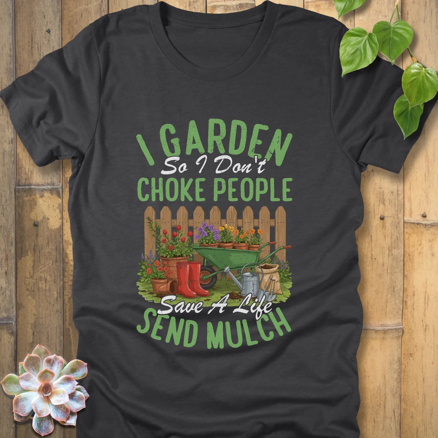 Dark Grey Heather t-shirt featuring the design 'I garden so I don't choke people, save a life send mulch' with plants and tools graphic