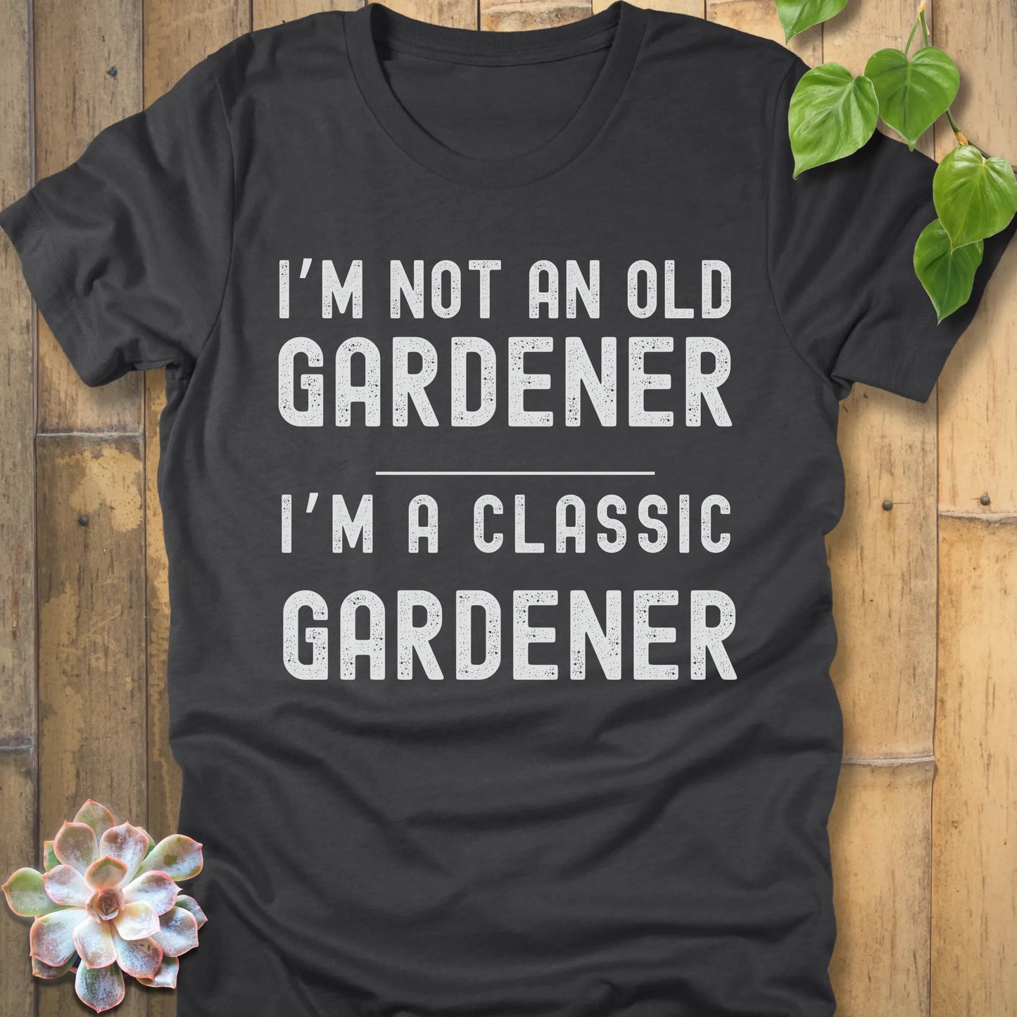 Dark Grey Heather t-shirt featuring the design I'm Not An Old Gardener printed in bold black letters, funny gardening fall shirt.