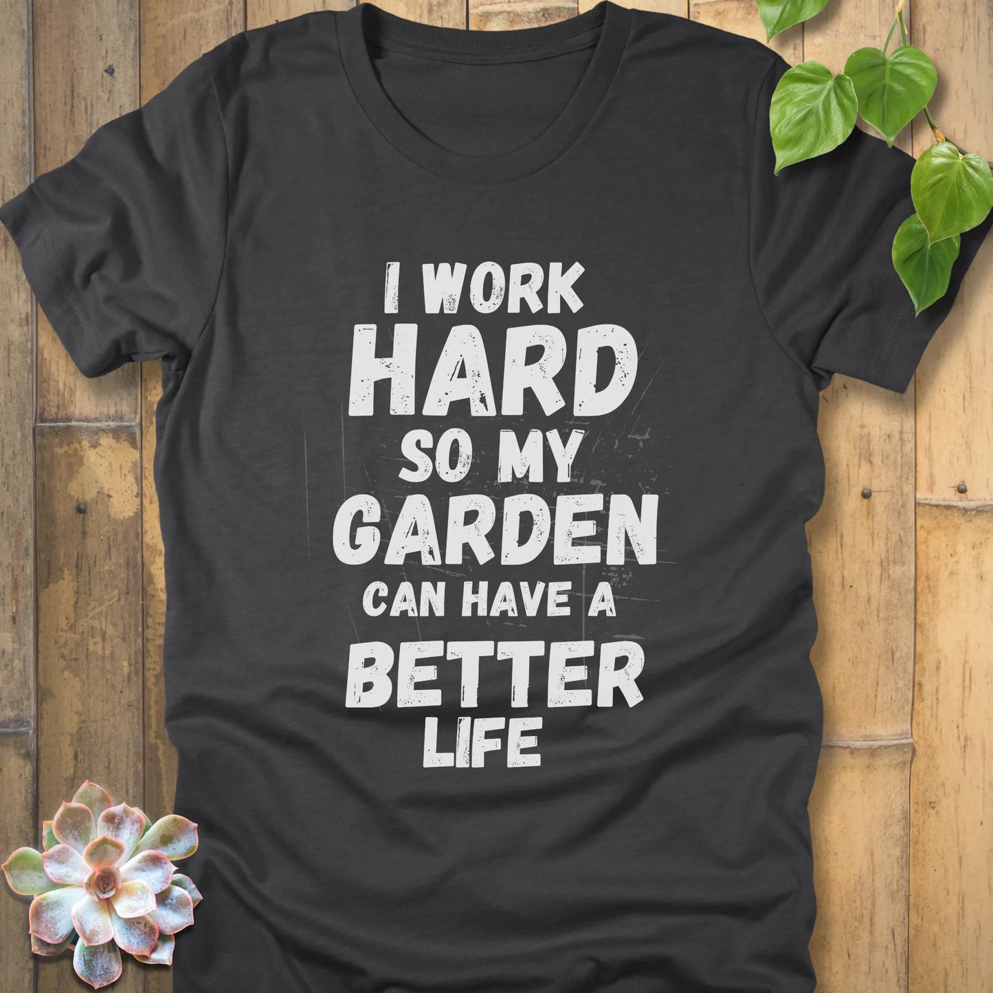 Dark Grey Heather t-shirt featuring the design I work hard so my garden can have a better life in bold lettering.