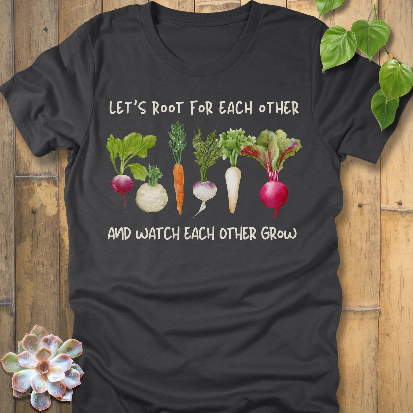 Dark Grey Heather t-shirt featuring the design Let’s Root printed in bold letters and a vegetables, casual gardening shirt.