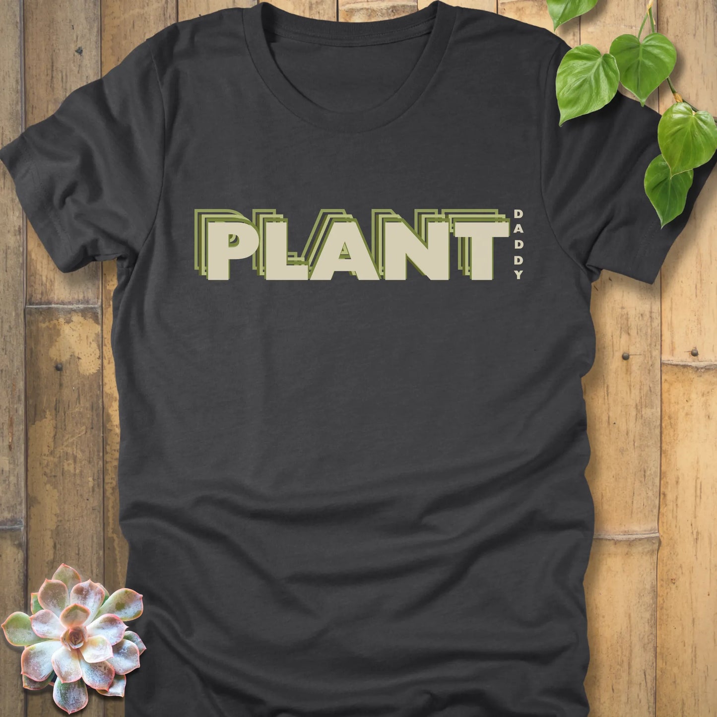 Dark Grey Heather t-shirt featuring the design Plant Daddy printed in bold letters, soft cotton botanical shirt.