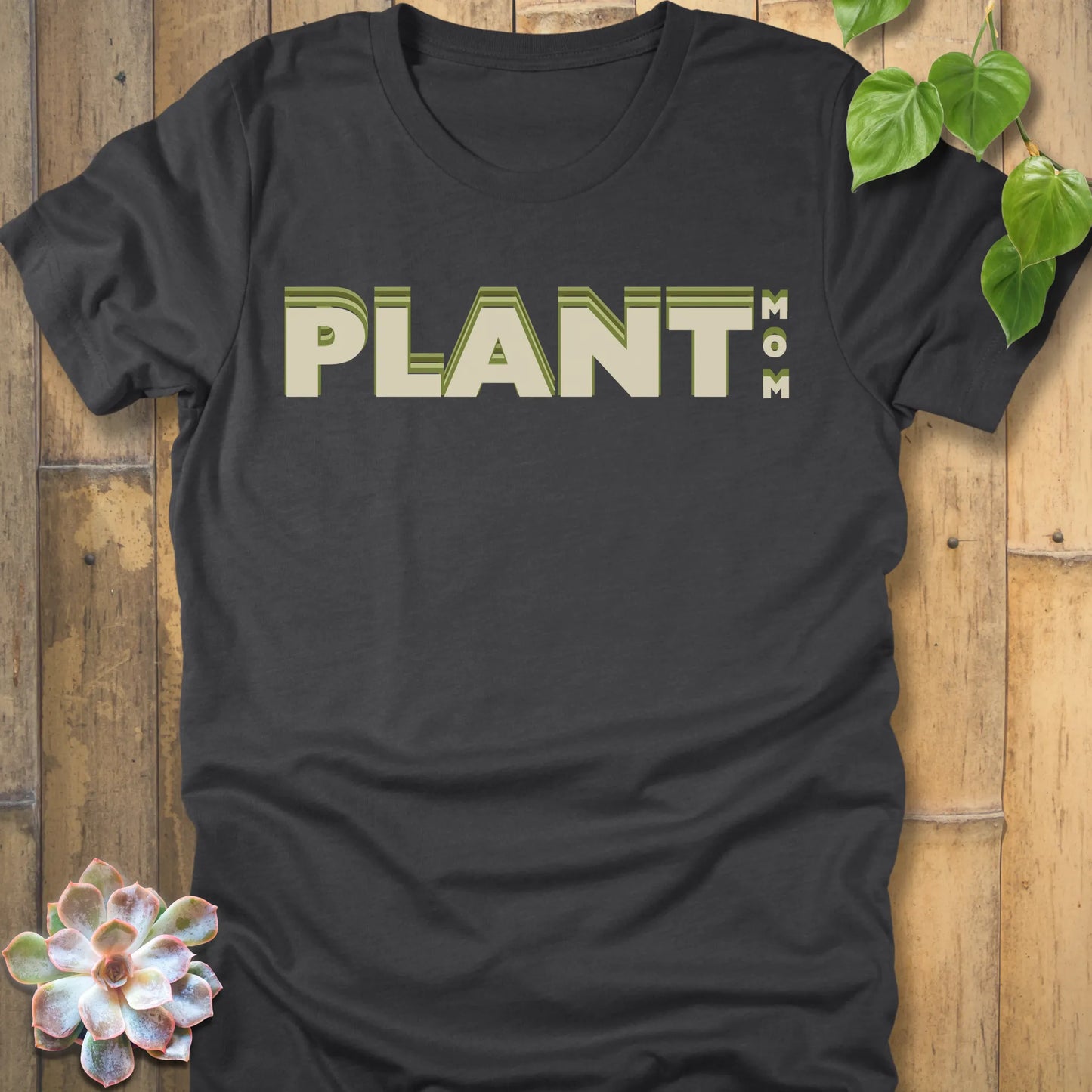 Dark Grey Heather t-shirt featuring the design Plant Mom printed in bold green letters