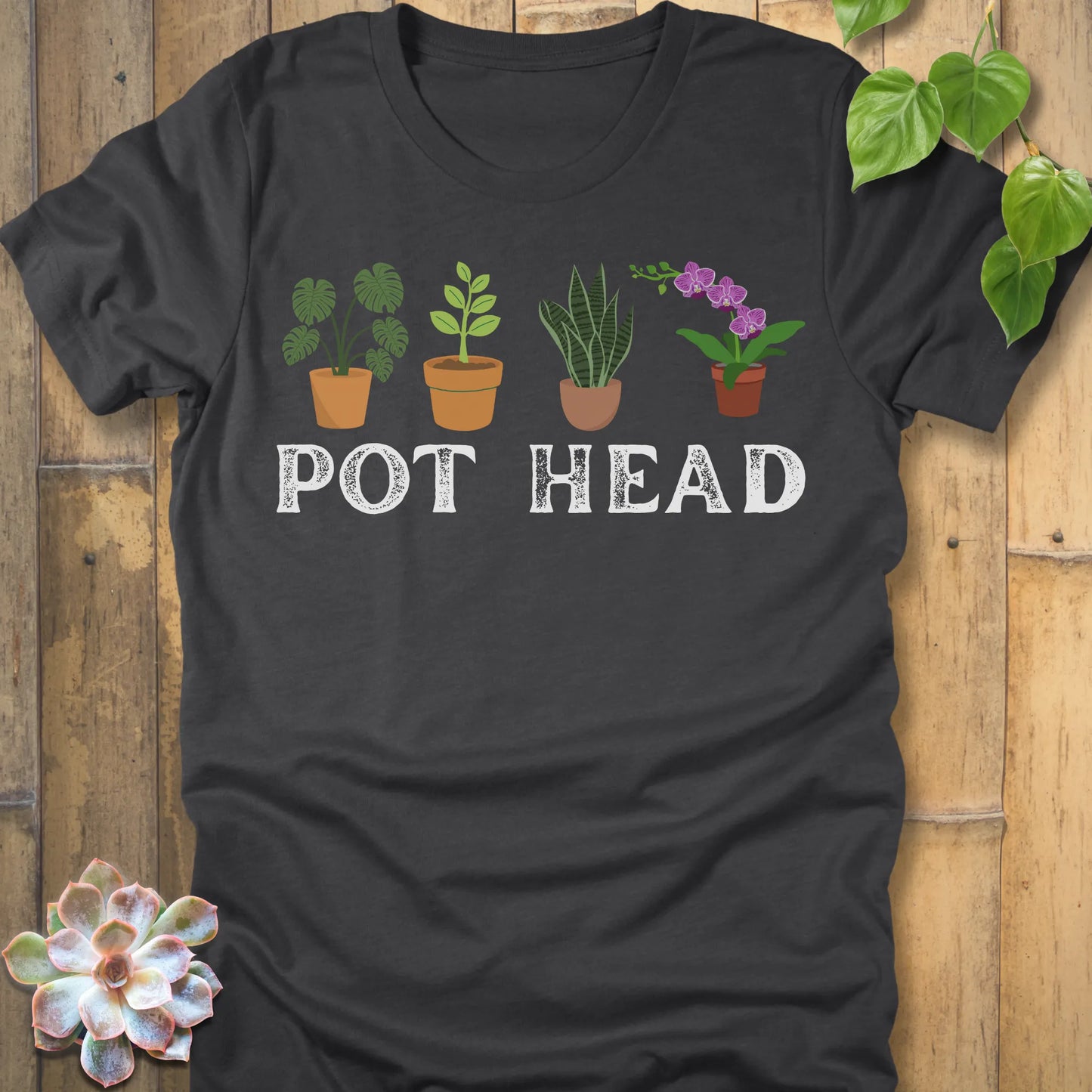 Dark Grey Heather t-shirt featuring the design Pot Head printed in bold letters and plants in the pots, funny gardening shirt.