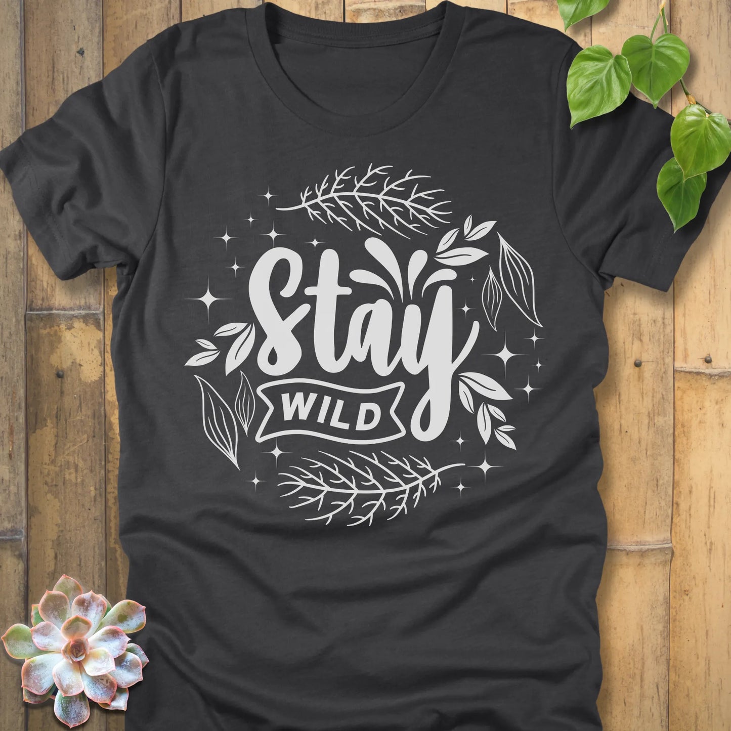 Dark Grey Heather t-shirt featuring the design Stay Wild printed in white letters, nature lover shirt.