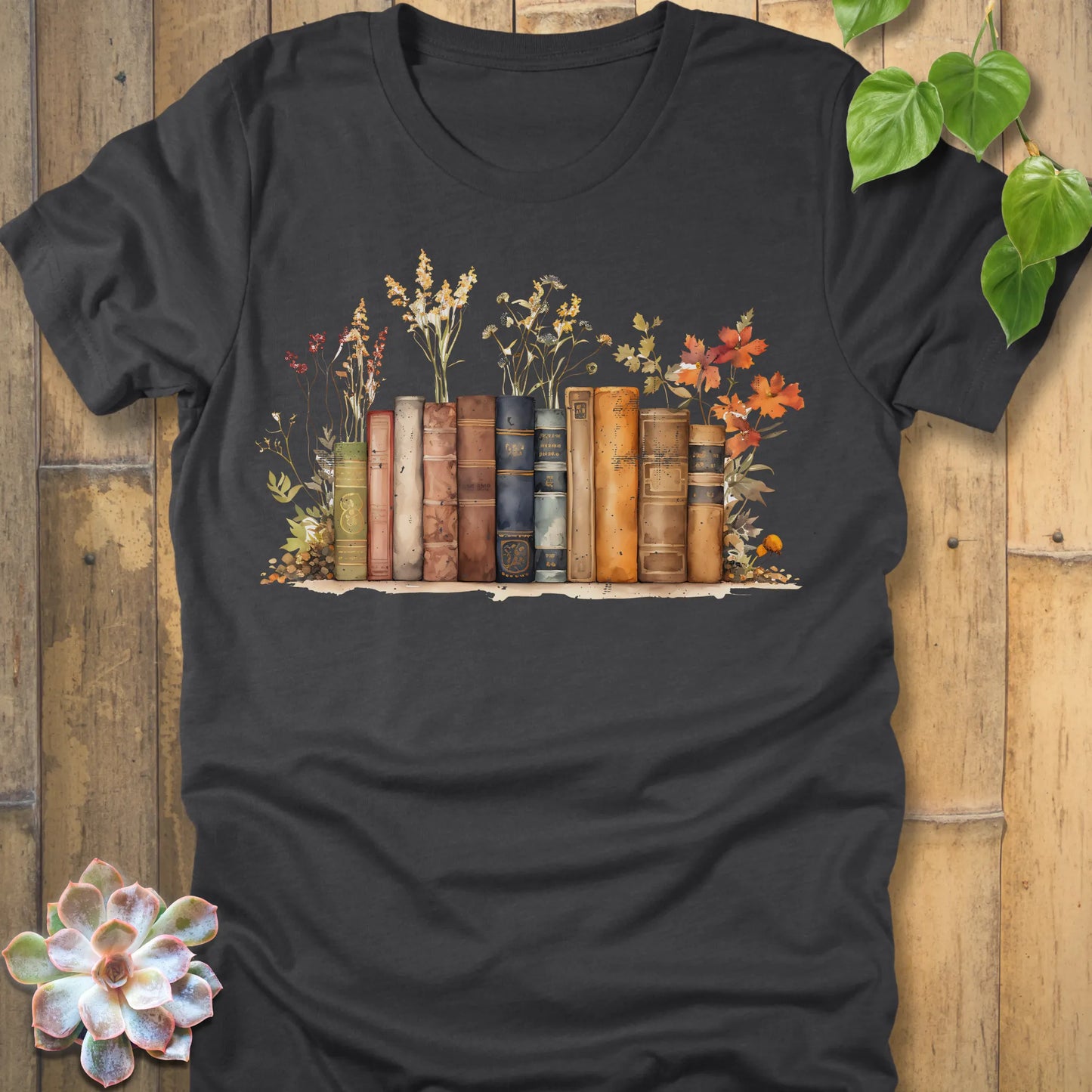 Dark Grey Heather t-shirt featuring the design Wildflower Library printed with books and plants, floral graphic tee for plant lovers.