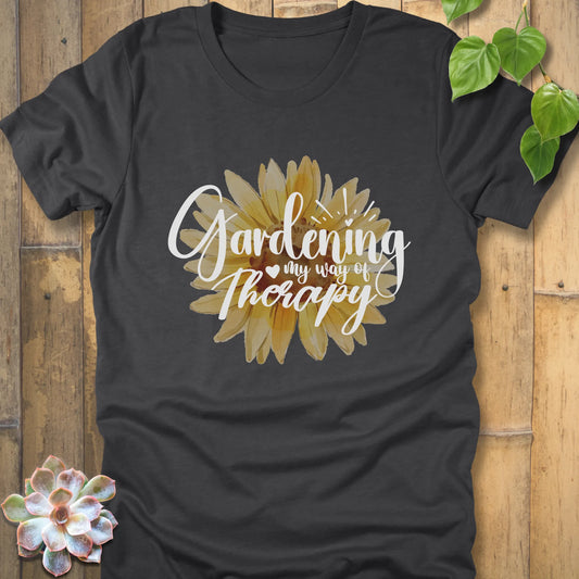 Dark grey heather t-shirt featuring the design Gardening my way of therapy with a sunflower in the center.
