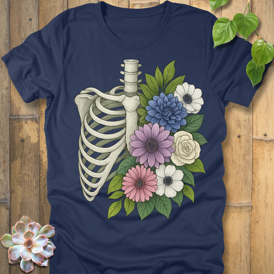 Floral Bones T-shirt in Heather Navy – ribcage with colorful flowers graphic, printed on Bella+Canvas soft cotton tee.