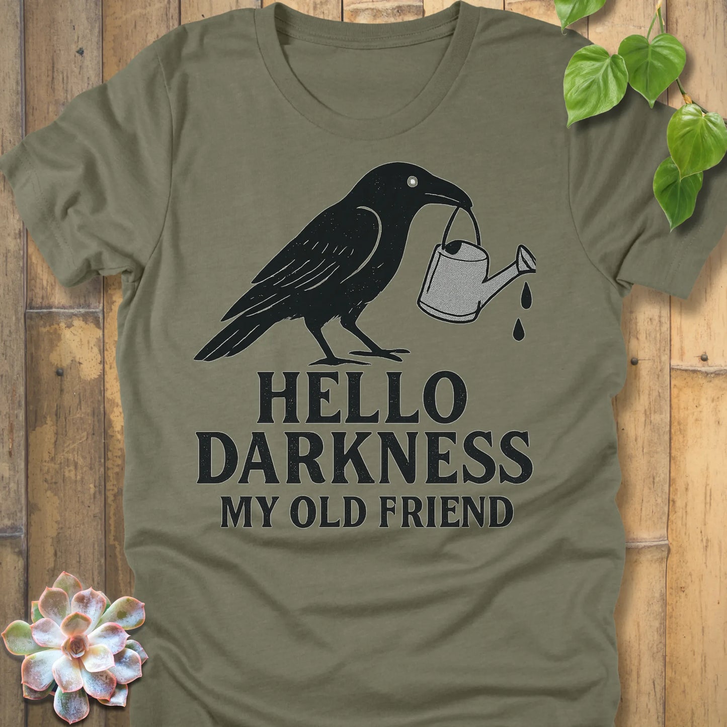 Heather Olive – Hello Darkness T-shirt in Heather Olive, crow watering can design, premium Bella+Canvas unisex tee.