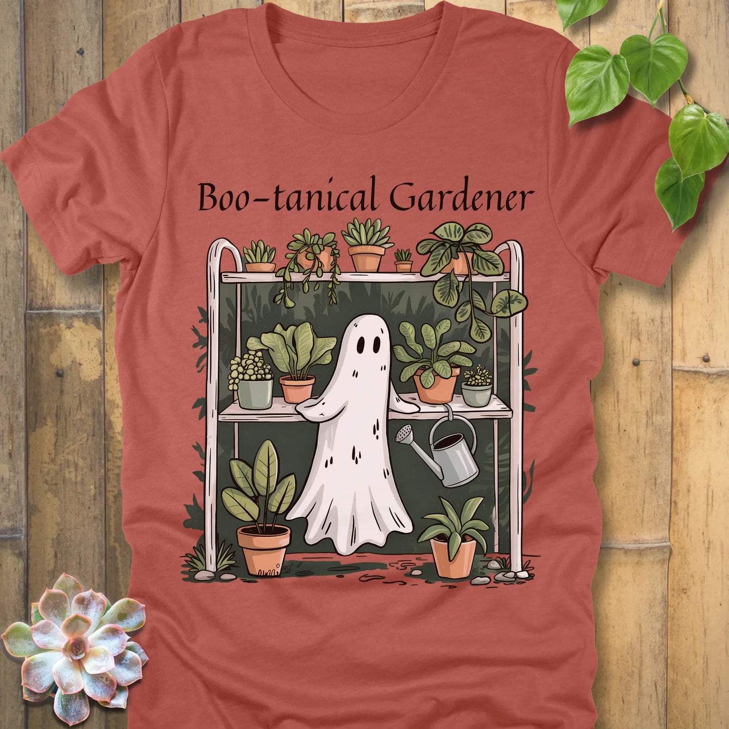 Heather Clay t-shirt featuring the design Boo – tanical Gardener printed in black letters and a ghost in garden