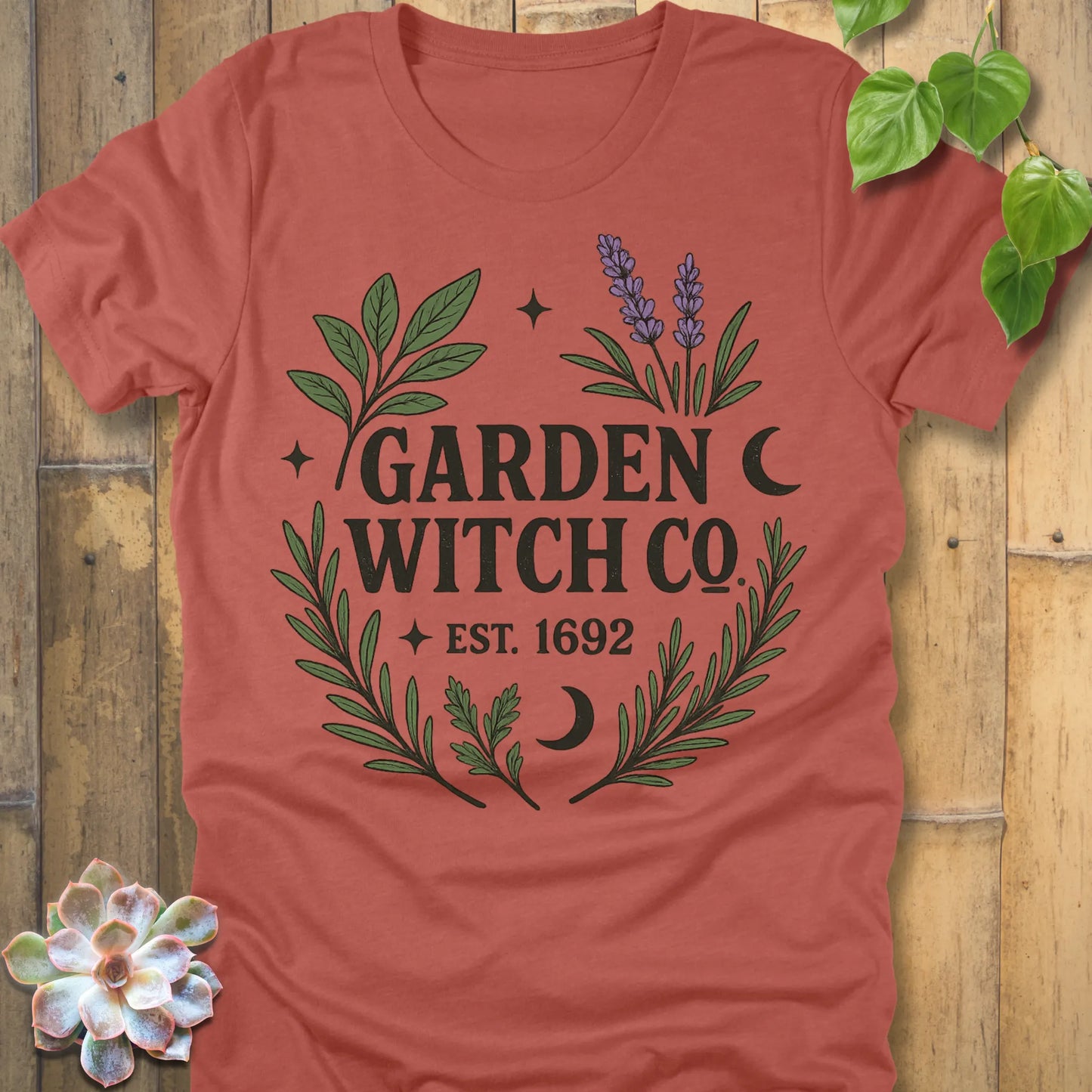 Heather Clay t-shirt featuring the design Garden Witch printed in witchy garden shirt.