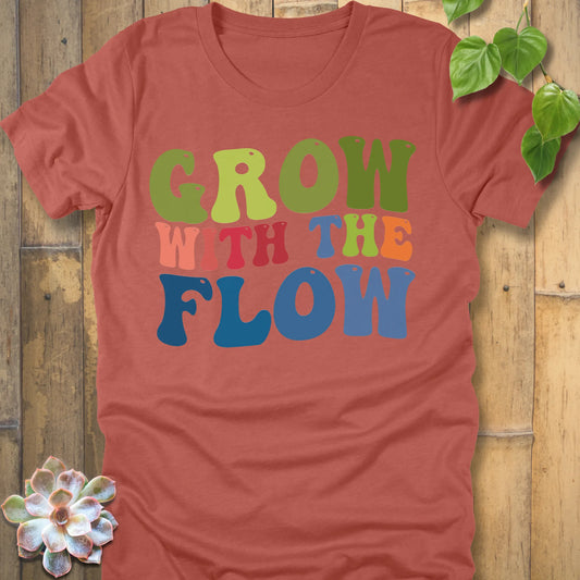 Heather Clay t-shirt featuring the design Grow In The Flow printed in colourful bold letters