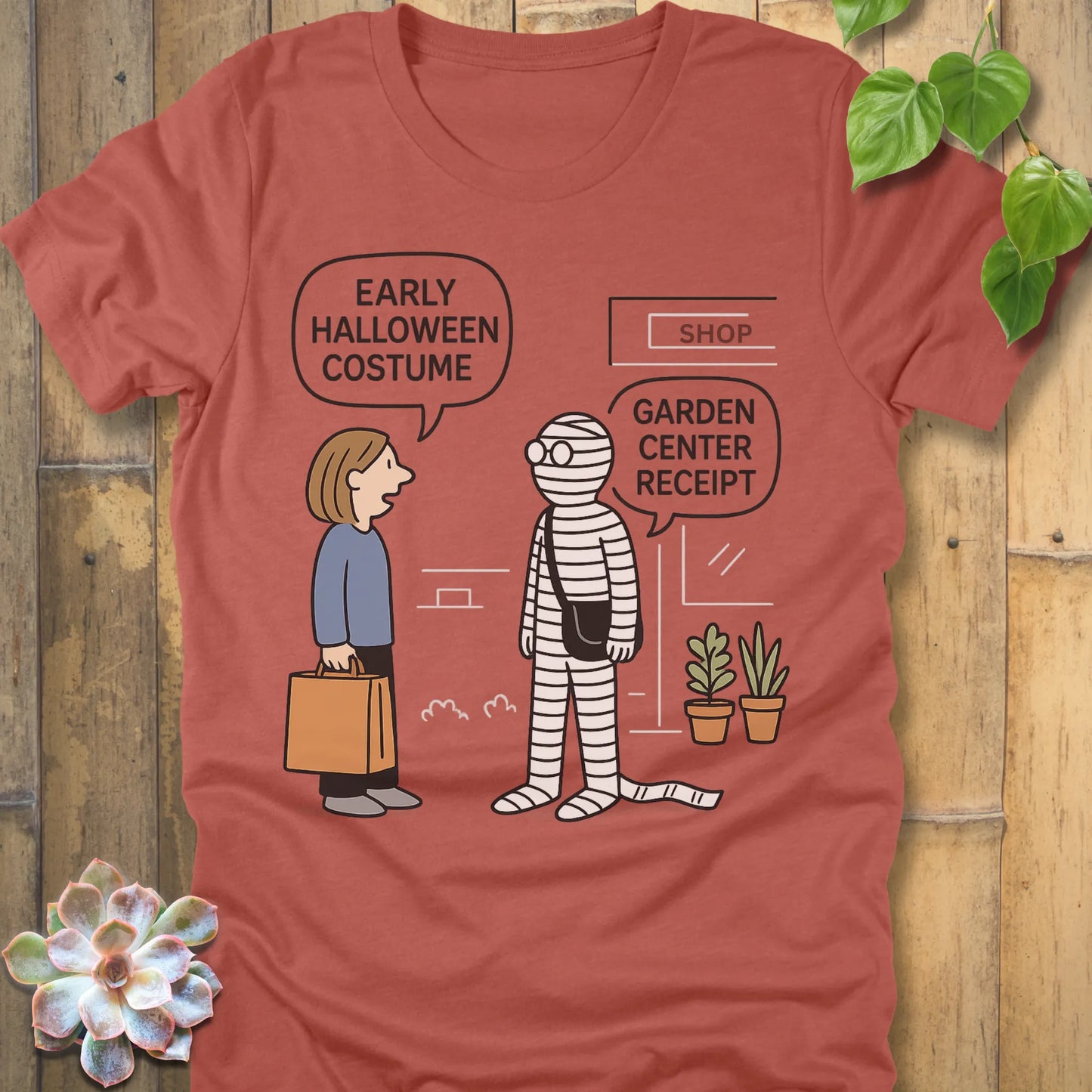 Heather Clay t-shirt featuring the design Halloween Costume printed in bold black letters, funny Halloween shirt.