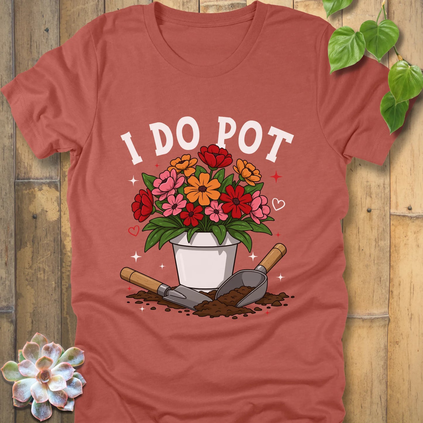 Heather Clay t-shirt featuring the design I Do Pot printed in bold letters with plants in the pot