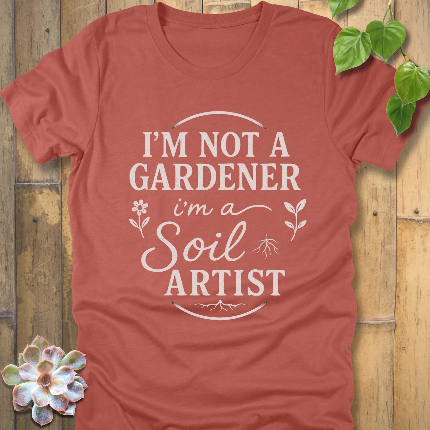 Heather Clay t-shirt featuring the design I'm Not a Gardener I'm a Soil Artist printed in bold white letters