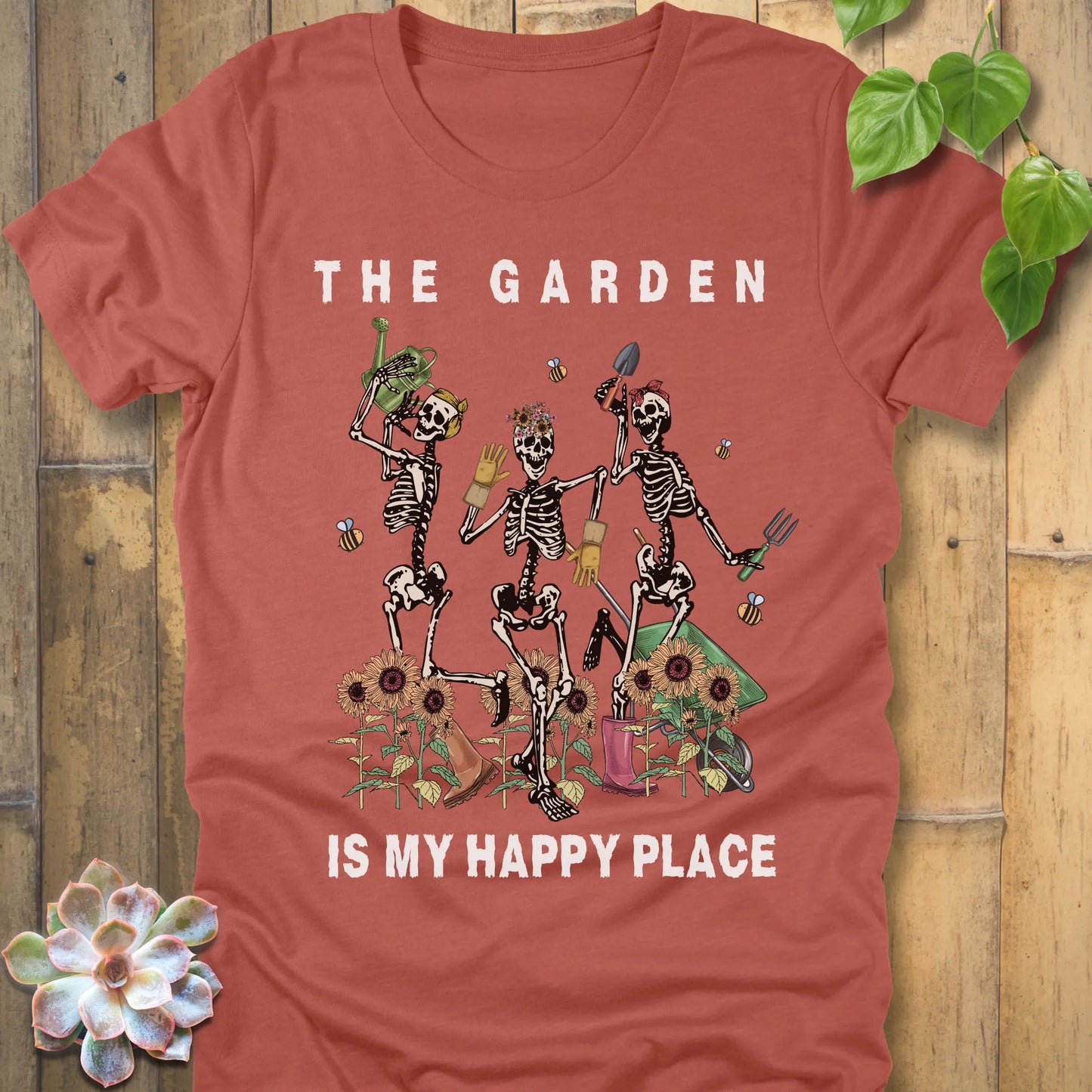 Heather Clay t-shirt featuring the design "My Happy Place" printed in bold white letters and a happy skeleton 
