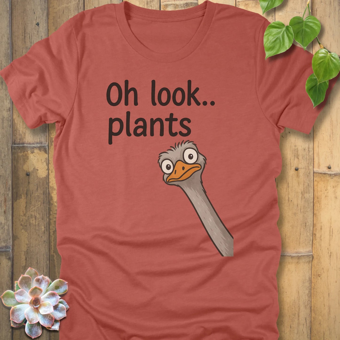 Heather Clay t-shirt featuring the design Oh Look Plants printed in black letters, with animal.